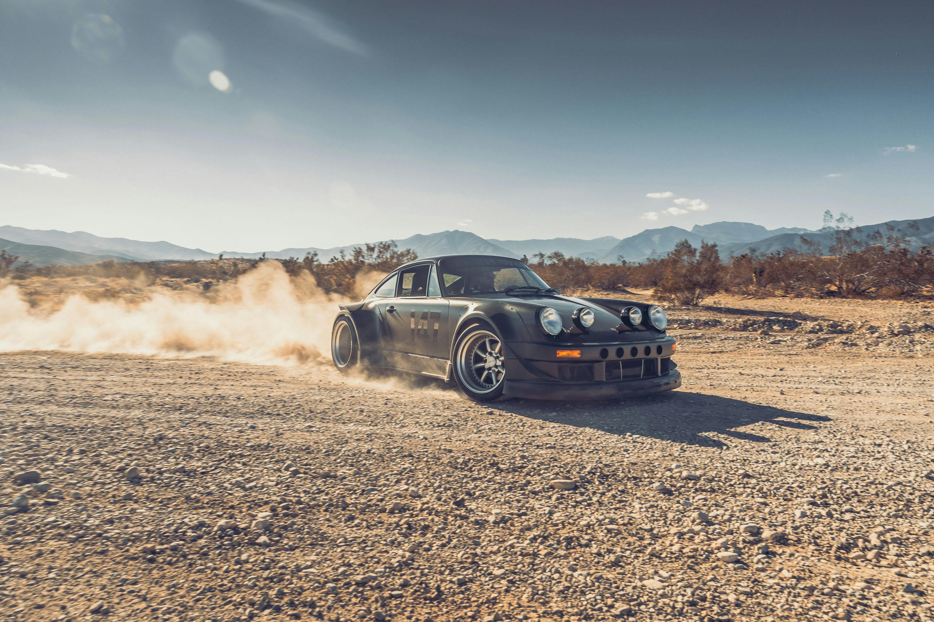 Porsche 964 throwing up dirt in Red Canyon